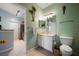 Bathroom featuring a view into the kitchen, a decorative parrot, and neutral tile flooring at 10764 70Th Ave # 4305, Seminole, FL 33772