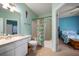 Bathroom featuring decorative shower curtain, tile floors and a view into bedroom at 10764 70Th Ave # 4305, Seminole, FL 33772