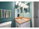 Bright bathroom featuring vanity with sink and mirror, next to the toilet at 10764 70Th Ave # 4305, Seminole, FL 33772