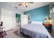 Bedroom featuring a view into bathroom, view of living room, tile flooring and ceiling fan at 10764 70Th Ave # 4305, Seminole, FL 33772