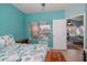 Bedroom featuring a window with blinds, ceiling fan, and views of the living room at 10764 70Th Ave # 4305, Seminole, FL 33772