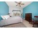 Comfortable bedroom with a ceiling fan, dresser, a window and tile flooring at 10764 70Th Ave # 4305, Seminole, FL 33772
