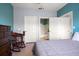 Cozy bedroom with rocking chair, dresser, and ensuite bathroom access at 10764 70Th Ave # 4305, Seminole, FL 33772
