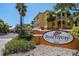 Sunny view of Beachway Condominiums community sign, surrounded by lush tropical landscaping at 10764 70Th Ave # 4305, Seminole, FL 33772