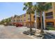 Apartment building with covered parking and palm trees at 10764 70Th Ave # 4305, Seminole, FL 33772