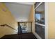 Outdoor hallway with railings leading to condo units with relaxing balconies with comfortable seating at 10764 70Th Ave # 4305, Seminole, FL 33772