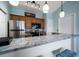 Modern kitchen featuring granite countertops, stainless steel appliances and hanging pendant lights at 10764 70Th Ave # 4305, Seminole, FL 33772