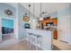 Kitchen featuring a breakfast bar with pendant lights at 10764 70Th Ave # 4305, Seminole, FL 33772