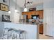 Kitchen featuring a breakfast bar with seating and stainless steel appliances at 10764 70Th Ave # 4305, Seminole, FL 33772