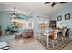 Bright living room with a dining area, ceiling fan, and large windows at 10764 70Th Ave # 4305, Seminole, FL 33772