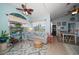 Inviting living room with a dining area, ceiling fan, and natural light at 10764 70Th Ave # 4305, Seminole, FL 33772