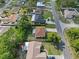 Aerial view of a residential neighborhood with well-maintained homes and mature trees at 11251 Pickford St, Spring Hill, FL 34609