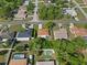 An aerial view of a residential neighborhood featuring single-Gathering homes, lawns, and paved roads at 11251 Pickford St, Spring Hill, FL 34609