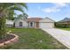 Charming single-story home with a well-manicured lawn and a brick-paved driveway at 11251 Pickford St, Spring Hill, FL 34609
