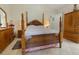 Comfortable main bedroom with tiled floors, a ceiling fan, and a full ensuite bath at 11251 Pickford St, Spring Hill, FL 34609
