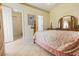 Inviting main bedroom features tile floors, ensuite bathroom, and a large closet at 11251 Pickford St, Spring Hill, FL 34609