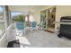 Relaxing screened-in patio with a dining table, chairs, and a grill at 11251 Pickford St, Spring Hill, FL 34609