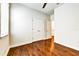 Spacious bedroom featuring hardwood floors, a ceiling fan, and a double door closet at 11613 Sweet Tangerine Ln, Tampa, FL 33626