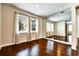 Bedroom with hardwood floors, natural light, and mirrored closet at 11613 Sweet Tangerine Ln, Tampa, FL 33626