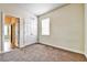 Bedroom with light brown carpet and doors to hallway and closet at 11613 Sweet Tangerine Ln, Tampa, FL 33626