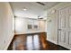 Bright bonus room featuring a ceiling fan and hardwood floors at 11613 Sweet Tangerine Ln, Tampa, FL 33626