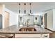 Open concept kitchen featuring a large island with double sinks and modern pendant lighting at 11613 Sweet Tangerine Ln, Tampa, FL 33626