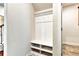 Well-organized mudroom with built-in bench and storage, providing a functional space at 11613 Sweet Tangerine Ln, Tampa, FL 33626