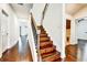 Staircase with wood steps and decorative iron railing leading to the second floor at 11613 Sweet Tangerine Ln, Tampa, FL 33626
