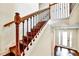Elegant staircase with decorative iron railing and wood steps, providing access to the upper level at 11613 Sweet Tangerine Ln, Tampa, FL 33626