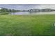 Expansive backyard with serene lake views, creating a private oasis for outdoor enjoyment and relaxation at 11634 Woodleaf Dr, Bradenton, FL 34211