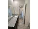 Bathroom with granite countertop vanity and tile flooring at 11634 Woodleaf Dr, Bradenton, FL 34211