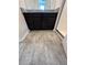 Bathroom with vanity, granite countertop, dark cabinets, grey tile flooring, and glass enclosed shower at 11634 Woodleaf Dr, Bradenton, FL 34211