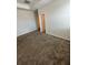 Bedroom features carpet flooring and a white door at 11634 Woodleaf Dr, Bradenton, FL 34211