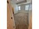 Bedroom features carpet flooring, natural light and a walk-in closet at 11634 Woodleaf Dr, Bradenton, FL 34211
