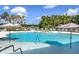 Resort-style community pool with sun umbrellas and plenty of seating for residents at 11634 Woodleaf Dr, Bradenton, FL 34211
