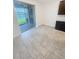 Bright dining area with tile flooring, sliding glass door, and dark cabinets at 11634 Woodleaf Dr, Bradenton, FL 34211