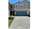 Charming townhome featuring a two-car garage and a beautifully paved driveway at 11634 Woodleaf Dr, Bradenton, FL 34211