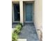 Close up of the front door that features nice landscaping around the entrance at 11634 Woodleaf Dr, Bradenton, FL 34211