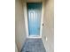 Stylish home featuring a welcoming blue front door and stone entrance, adding curb appeal to the property at 11634 Woodleaf Dr, Bradenton, FL 34211