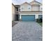 Charming townhome with a paved driveway and two-car garage offering great curb appeal at 11634 Woodleaf Dr, Bradenton, FL 34211