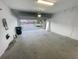 Spacious two-car garage offering ample storage and convenient access, perfect for vehicles and hobbies at 11634 Woodleaf Dr, Bradenton, FL 34211