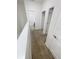 Upstairs hallway with carpet and white doors leading to various rooms at 11634 Woodleaf Dr, Bradenton, FL 34211