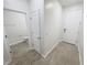 Hallway leading to a bathroom and the main entrance at 11634 Woodleaf Dr, Bradenton, FL 34211
