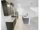 Modern kitchen with granite countertops, stainless steel appliances and a large kitchen island at 11634 Woodleaf Dr, Bradenton, FL 34211