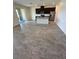 Modern kitchen with stainless steel appliances and dark cabinets, with an island sink at 11634 Woodleaf Dr, Bradenton, FL 34211