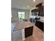 Modern kitchen featuring stainless steel appliances and a granite island at 11634 Woodleaf Dr, Bradenton, FL 34211