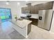 Modern kitchen featuring granite countertops, stainless steel appliances, and kitchen island at 11634 Woodleaf Dr, Bradenton, FL 34211