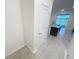 View of the kitchen and sliding glass doors leading to the outside at 11634 Woodleaf Dr, Bradenton, FL 34211