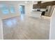 Bright, open-concept living space featuring tile flooring, lots of windows and modern finishes throughout at 11634 Woodleaf Dr, Bradenton, FL 34211