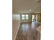 Bright living room with tile floors and sliding doors leading to a water view at 11634 Woodleaf Dr, Bradenton, FL 34211
